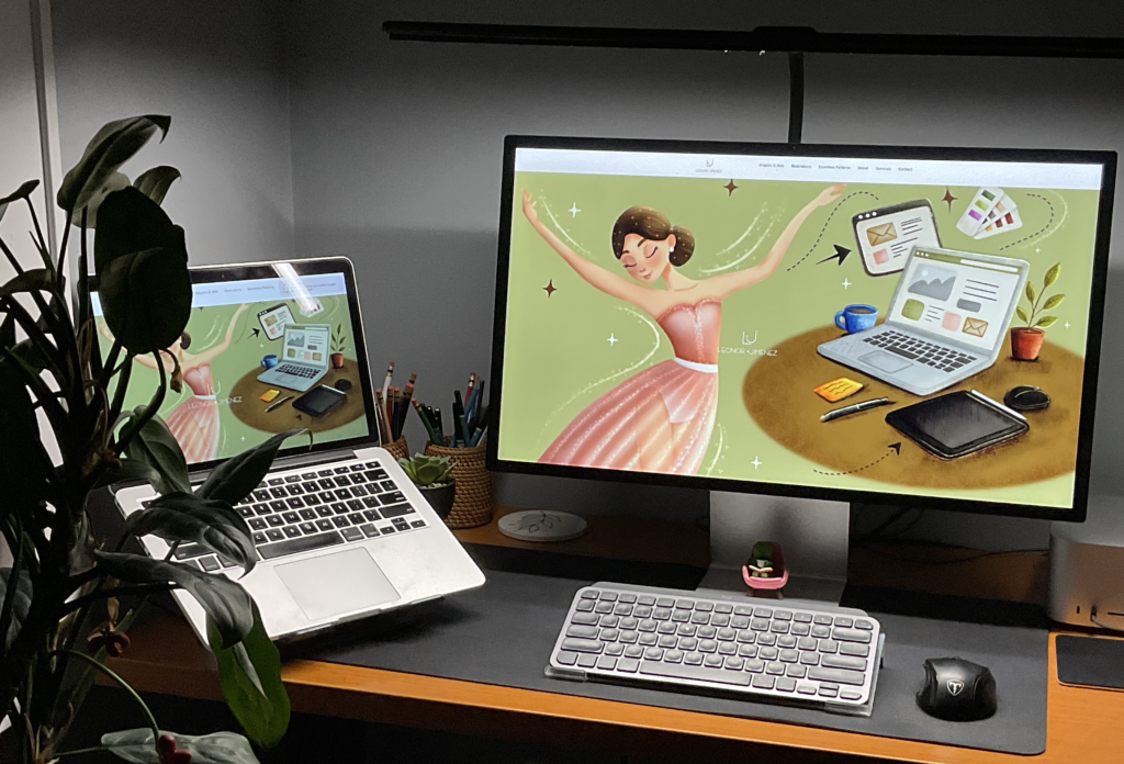 Mac Studio desktop and laptop displaying the Leonor Jimenez Design Studio homepage illustration, surrounded by pencil holders, a small plant, and a desk figurine